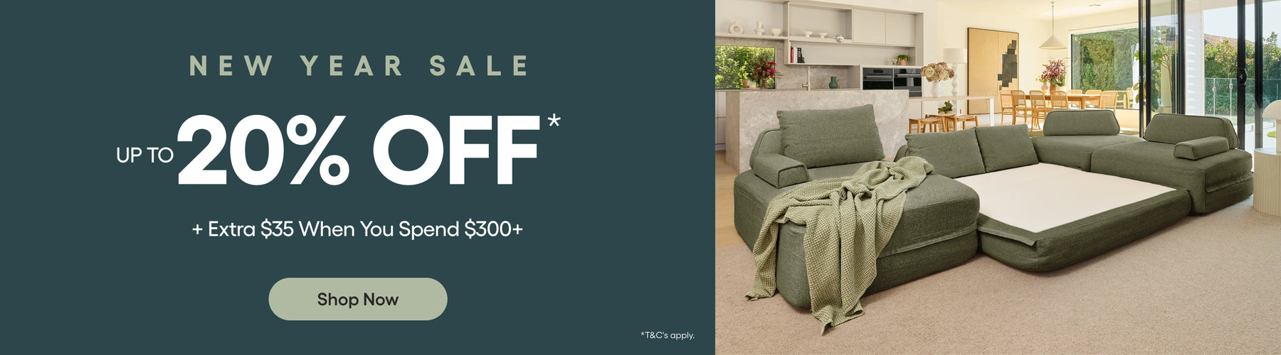 Promotional banner for a new year sale with a green sectional sofa in a living room.