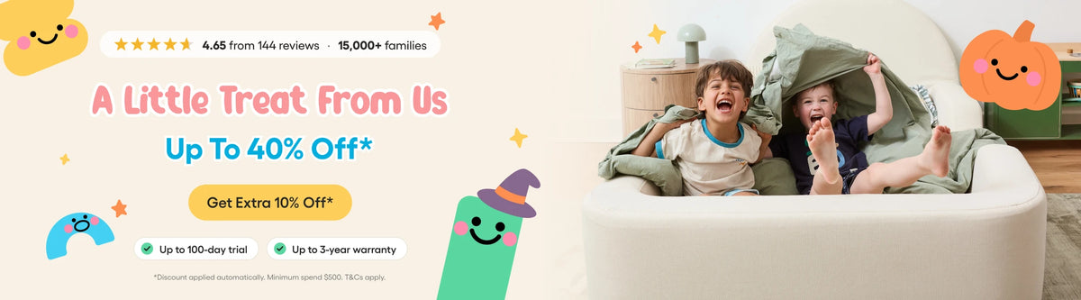 Promotional banner for a baby seat cushion set, featuring a cartoon illustration on the left with text 'A Little Treat From Us' and a lifestyle photo on the right of a baby and toddler sitting in a green cushioned seat insert on a white chair.