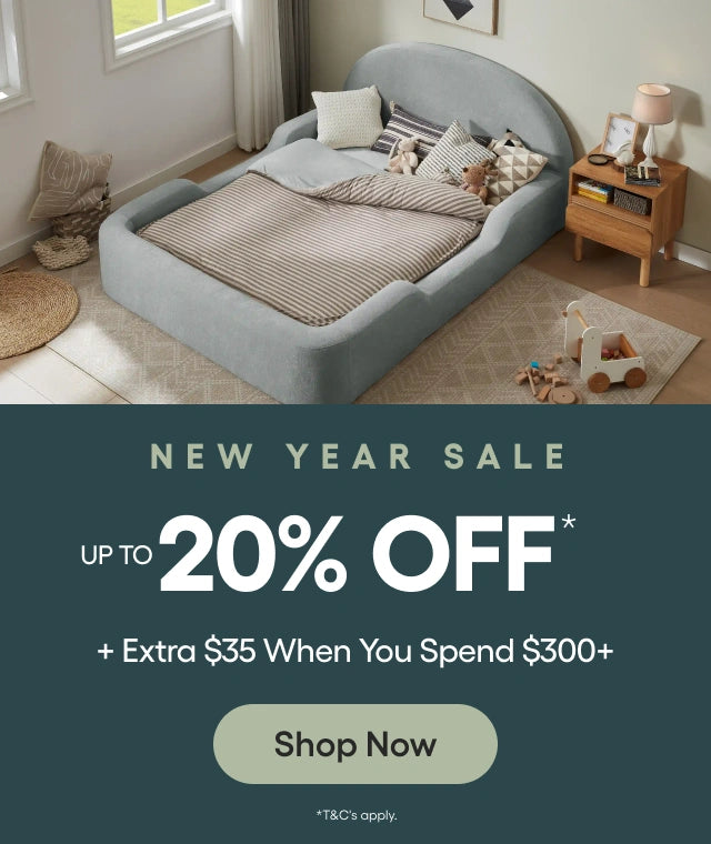 Children's bed with bedding in a room setting, promotional banner for New Year sale with discount offer.